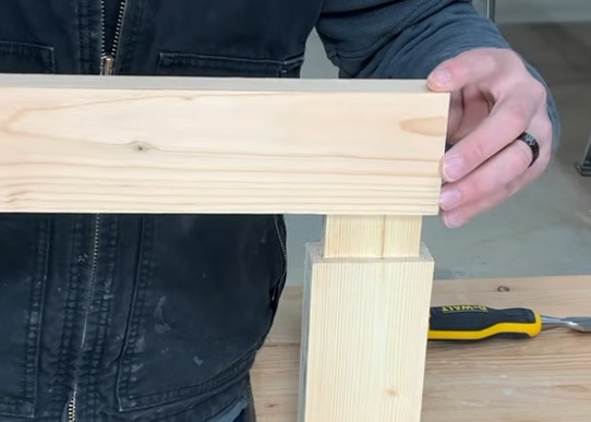 Test fitting a blind mortise and tenon joint before assembly