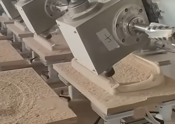 CNC wood machining creating intricate patterns on a wooden panel