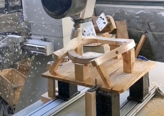 Wood pieces being shaped in CNC woodworking process