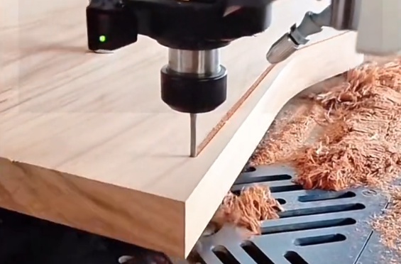 CNC machine cutting a wooden board precisely