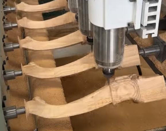 Industrial wood milling machine in a manufacturing facility
