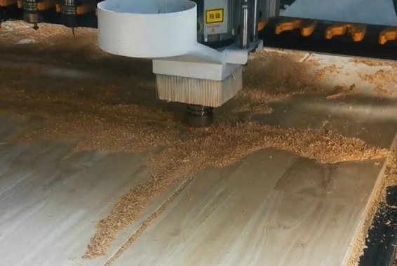 Close-up of CNC wood milling router bit during cutting operation