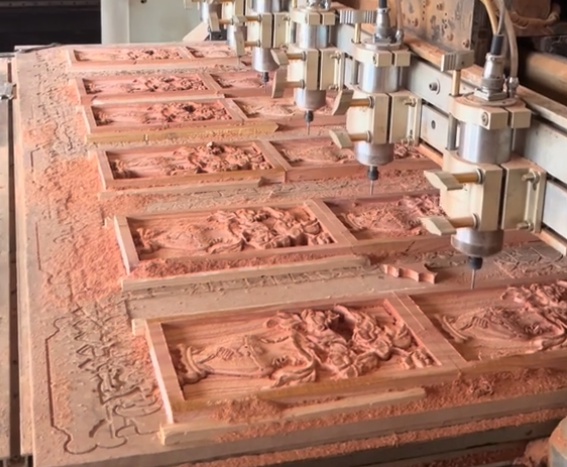 Computer controlled CNC engraving machine carving wood
